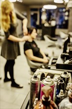 Cans of hairspray in a hairdressing salon