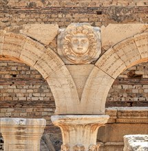 Columned arch with a Medusa head