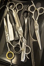 Scissors and comb in a hairdressing salon