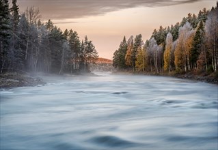 Autumnal atmosphere on the river in the evening light