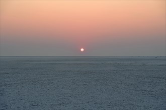 Wide plain of the Makgadikgadi salt pans at sunset