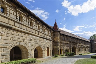 Fortress wall with small tower and arcades