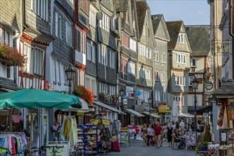Shopping street with historic half-timbered houses