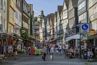 Shopping street with historic half-timbered houses