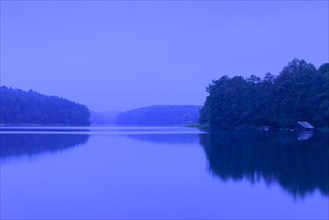 Blue hour at the lake Schmaler Luzin with boathouse
