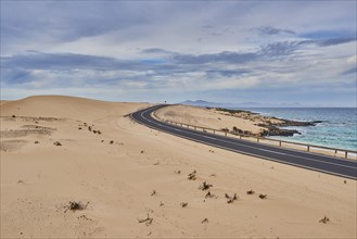 Coastal road through sand dunes