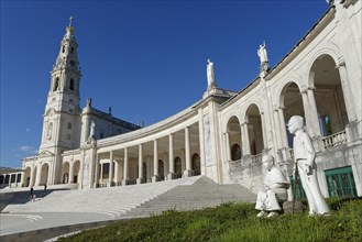 Statues of two little shepherds in front of the Basilica of Our Lady of the Rosary
