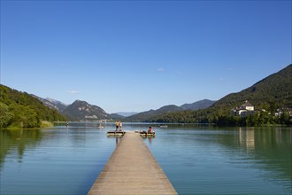 Bathing beach at the Fuschlsee with Fuschl Castle