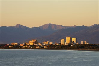 Skyline in the evening light in front of mountain range