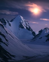 Beautiful Tsagaan suvarga peak under moon light. Bayan-Ulgii province