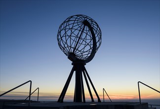 Steel globe on the North Cape after sunset