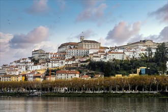 Coimbra cityscape with Mondego river by sunset