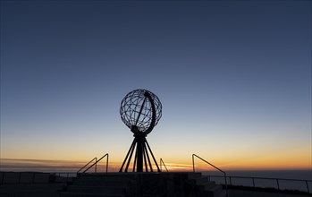 North Cape with steel globe after sunset