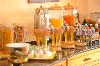 Breakfast buffet with muesli and fruit juices