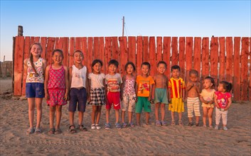 Children pose in a row