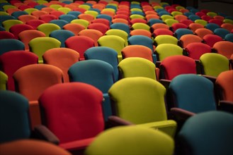 Colourful chairs in the empty auditorium