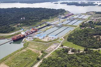 Aerial view of two Neo-Panamax container ships crossing the third set of locks at the pacific side