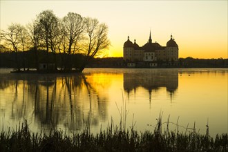 Sunrise at Moritzburg Castle with reflection in the castle pond