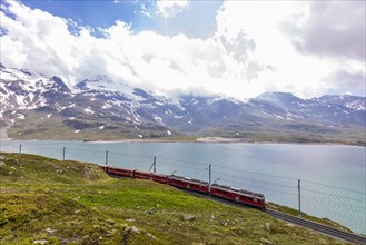 Rhaetian Railway in front of the Lago Bianco reservoir