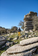 Young man standing on rocks