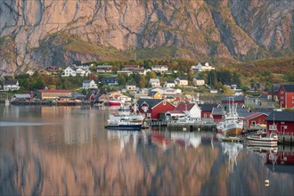 Wooden houses settlement on Reinefjord with fishing boats