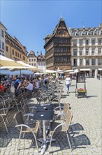 Street cafes at the Place de la Cathedrale with Maison Kammerzell