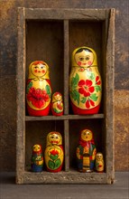 Russian dolls in a wooden box