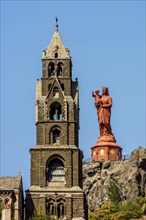 Cathedral bell tower and statue of the Virgin Mary