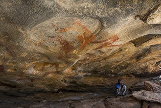 Local guide below cave paintings in Laas Geel caves