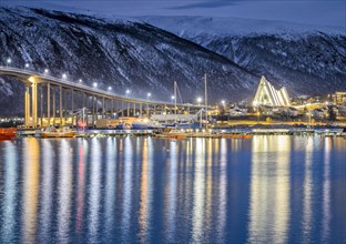 View over the harbour and city with Tromsobrua or Tromso Bridge
