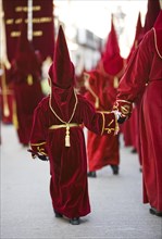Child in penitential attire in the procession for Holy Week in Baeza