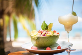 Nicaraguan food of a coconut with ceviche and fruit drink