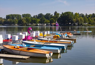 Electric boats on the shore of the Waginger SeeWaginger See with sailing boat