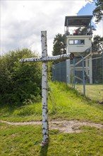 Cross of birch wood at the former death strip of the inner-German border