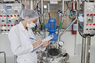 Employee checks data at the cosmetics factory in Itupeva