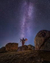 Mongolian shaman under sky full of stars. Terelj national park