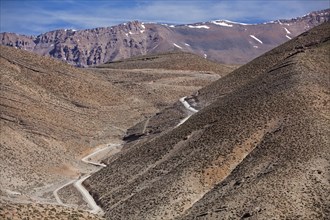 Off-road vehicle on gravel road to Mount Mgoun