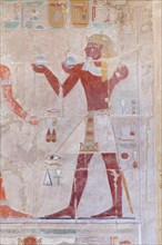 Bas relief picture depicting a pharaoh making offerings