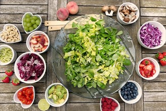 Salad table served in cup with nice wooden background