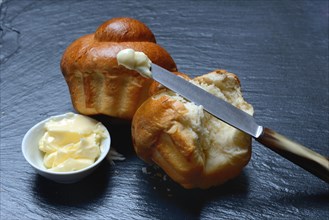 Brioches and bowls with butter