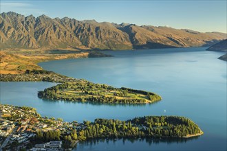 View over Queenstown and Lake Wakatipu to the Remarkables at sunset