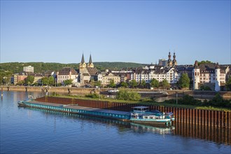 Peter Altmeier bank on the Moselle with old town and inland waterway vessel in the evening light