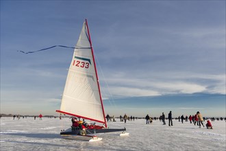 Ice sailors and skaters on the Duemmer in winter