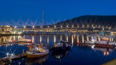 Blue hour in the port of Tromsoe with the bridge