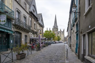 Street with restaurants and church Eglise Notre-Dame