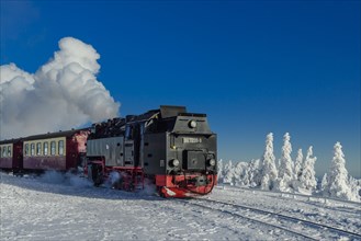 Brocken Railway travels through snowy landscape up the Brocken