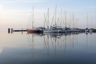 Sailing boats reflected in the water of the Bodden