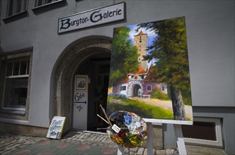 Oil painting in front of the entrance to the Burgtor-Galerie
