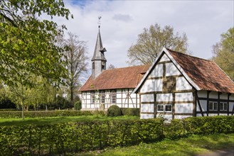 View of the church and village school with half-timbered houses in the museum village Cloppenburg
