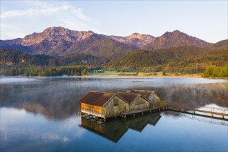 Boathouses in the Lake Kochel near Schlehdorf in the morning light